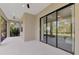 Relaxing screened porch with sliding glass doors and ceiling fans at 12654 Harney St, Venice, FL 34293