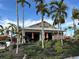 Exterior view of Bahama Bar, featuring outdoor seating and palm trees at 12826 Sorrento Way, Bradenton, FL 34211