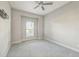 Spacious bedroom with carpet, large window and ceiling fan at 12826 Sorrento Way, Bradenton, FL 34211