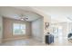 Neutral-toned dining room with tile floors and a view into the kitchen area at 12826 Sorrento Way, Bradenton, FL 34211