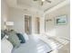 Bright and airy main bedroom with carpeted floors, a ceiling fan and ensuite bathroom at 12826 Sorrento Way, Bradenton, FL 34211