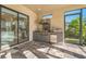 Outdoor kitchen with stainless steel appliances and granite countertops at 12826 Sorrento Way, Bradenton, FL 34211