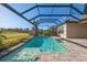 Inviting screened pool with a spa and lush landscaping at 12826 Sorrento Way, Bradenton, FL 34211