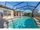 Inviting screened pool with a view of the backyard and golf course at 12826 Sorrento Way, Bradenton, FL 34211