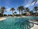 Resort-style pool with plenty of lounge chairs and umbrellas at 12826 Sorrento Way, Bradenton, FL 34211