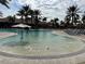 Community pool with a separate area with sandy bottom at 12826 Sorrento Way, Bradenton, FL 34211