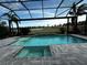 Relaxing pool and spa with a screened enclosure and golf course view at 12826 Sorrento Way, Bradenton, FL 34211