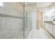 Large walk-in shower with neutral tile and glass enclosure at 12826 Sorrento Way, Bradenton, FL 34211