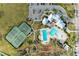 Resort-style pool and tennis courts from above at 13262 Jeter Creek Dr, Riverview, FL 33579