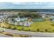 Aerial view of community amenities including pool, tennis courts, and clubhouse at 13262 Jeter Creek Dr, Riverview, FL 33579