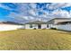 Backyard view of home with solar panels at 13262 Jeter Creek Dr, Riverview, FL 33579