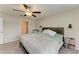 Comfortable main bedroom with ensuite bathroom access and ceiling fan at 13262 Jeter Creek Dr, Riverview, FL 33579