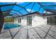 Resort-style pool and spa with covered patio at 13377 Alocasia Ln, Port Charlotte, FL 33981