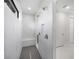 Spa-like shower with marble walls, a built-in seat, and double shower heads at 13377 Alocasia Ln, Port Charlotte, FL 33981