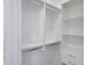 Large walk-in closet with shelves and hanging rods at 13377 Alocasia Ln, Port Charlotte, FL 33981