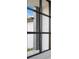 Stylish black framed window offers a view of the home's exterior at 13377 Alocasia Ln, Port Charlotte, FL 33981