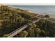 Aerial view showing beach access and boardwalk at 1465 Gulf Of Mexico Dr # 402, Longboat Key, FL 34228