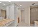 Spa-like bathroom with a walk-in shower and double vanity at 1465 Gulf Of Mexico Dr # 402, Longboat Key, FL 34228