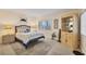 Bright bedroom with a comfortable bed, nightstands, and ample closet space at 1465 Gulf Of Mexico Dr # 402, Longboat Key, FL 34228