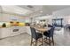 Open concept kitchen with granite counters and white appliances at 1465 Gulf Of Mexico Dr # 402, Longboat Key, FL 34228