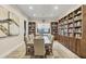 Library with built-in bookshelves and a large table for reading at 1465 Gulf Of Mexico Dr # 402, Longboat Key, FL 34228