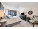 Spacious bedroom with a king-size bed and water views at 1465 Gulf Of Mexico Dr # 402, Longboat Key, FL 34228