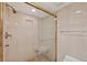 Clean shower with glass enclosure, tiled walls, and built-in seat at 1465 Gulf Of Mexico Dr # 402, Longboat Key, FL 34228