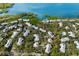 Aerial view of waterfront homes surrounded by lush vegetation at 1479 Landings Cir # 41, Sarasota, FL 34231