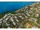 Aerial view of waterfront community with lush landscaping and private marina at 1479 Landings Cir # 41, Sarasota, FL 34231