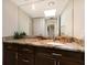 Bathroom with granite countertop and dark wood cabinets at 1479 Landings Cir # 41, Sarasota, FL 34231