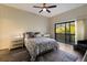 Bright bedroom with a queen-size bed and balcony access at 1479 Landings Cir # 41, Sarasota, FL 34231