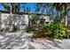 Two-story home with attached garage and lush landscaping at 1479 Landings Cir # 41, Sarasota, FL 34231