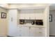 White kitchen cabinets and countertops with built-in microwave at 1479 Landings Cir # 41, Sarasota, FL 34231