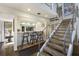 Modern staircase with metal railing, leading to upper level at 1479 Landings Cir # 41, Sarasota, FL 34231