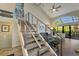 Modern staircase with wood steps and metal railing at 1479 Landings Cir # 41, Sarasota, FL 34231