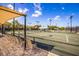 Well-maintained tennis courts with shade structures at 1479 Landings Cir # 41, Sarasota, FL 34231