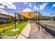 Covered seating area overlooking tennis courts and a pond at 1479 Landings Cir # 41, Sarasota, FL 34231