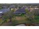 Aerial view of home with fenced backyard, pool, and water feature at 14901 17Th E Ave, Bradenton, FL 34212