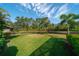 Landscaped backyard with pond and lush greenery at 14901 17Th E Ave, Bradenton, FL 34212