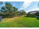 Spacious backyard with pond and privacy fence at 14901 17Th E Ave, Bradenton, FL 34212