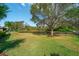 Spacious backyard with pond view and fenced perimeter at 14901 17Th E Ave, Bradenton, FL 34212