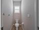 Small powder room with toilet and single sink at 14901 17Th E Ave, Bradenton, FL 34212