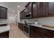 Bright kitchen with stainless steel appliances and dark wood cabinets at 14901 17Th E Ave, Bradenton, FL 34212