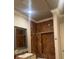 Bathroom with marble shower and vanity at 15986 Cutting Horse Trl, Myakka City, FL 34251