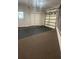 Finished garage interior with epoxy flooring and storage at 15986 Cutting Horse Trl, Myakka City, FL 34251