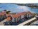 Condo building with terracotta roofs and parking at 1602 Stickney Point Rd # 1602-301, Sarasota, FL 34231