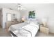 Bedroom with a queen-size bed, ceiling fan, and light and airy feel at 1602 Stickney Point Rd # 1602-301, Sarasota, FL 34231