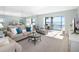 Spacious living room with water views and comfortable seating at 1602 Stickney Point Rd # 1602-301, Sarasota, FL 34231