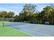 Well-maintained paddle tennis court with green and blue surface at 1602 Stickney Point Rd # 1602-301, Sarasota, FL 34231