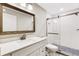 Modern bathroom with white vanity, quartz countertop, and a walk-in shower at 1608 80Th Nw St, Bradenton, FL 34209